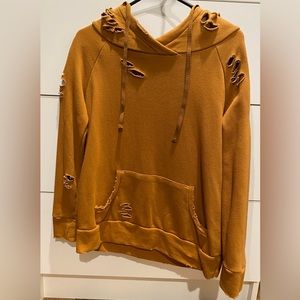 Size XS oversized distressed hoodie in mustard. New without tags